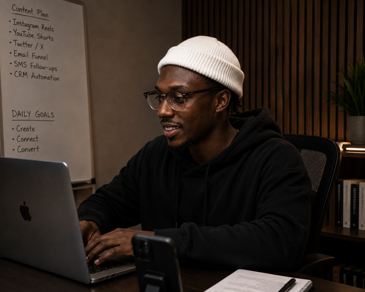 Jay Nzungize at his desk, Gateway Growth Studio